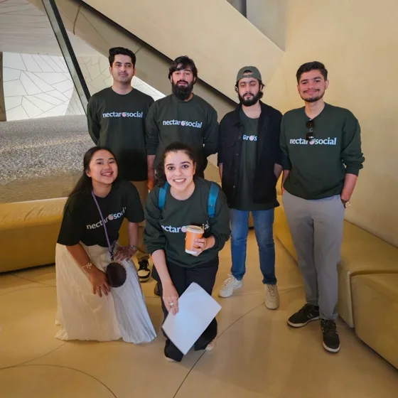 Six teammates in Nectar sweatshirts at the Doha offsite