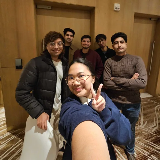 Seven teammates in a group selfie at the Doha offsite